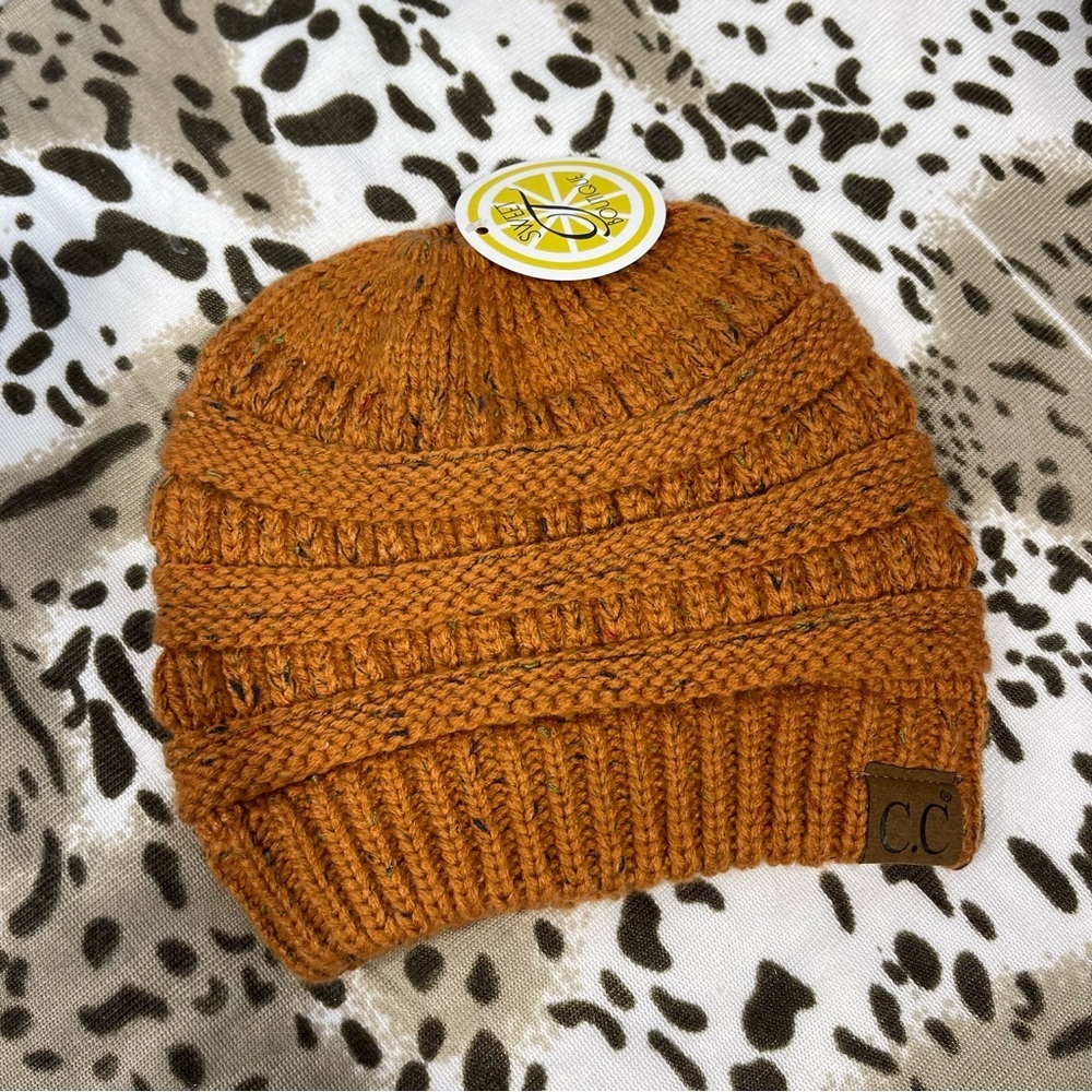 CC Boutique Warm Knit Hat in Rust Orange messy bun top